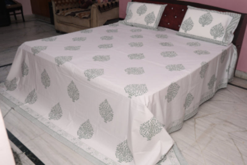 Slate medallion cotton sheet set styled on bed showing grey charcoal medallion print