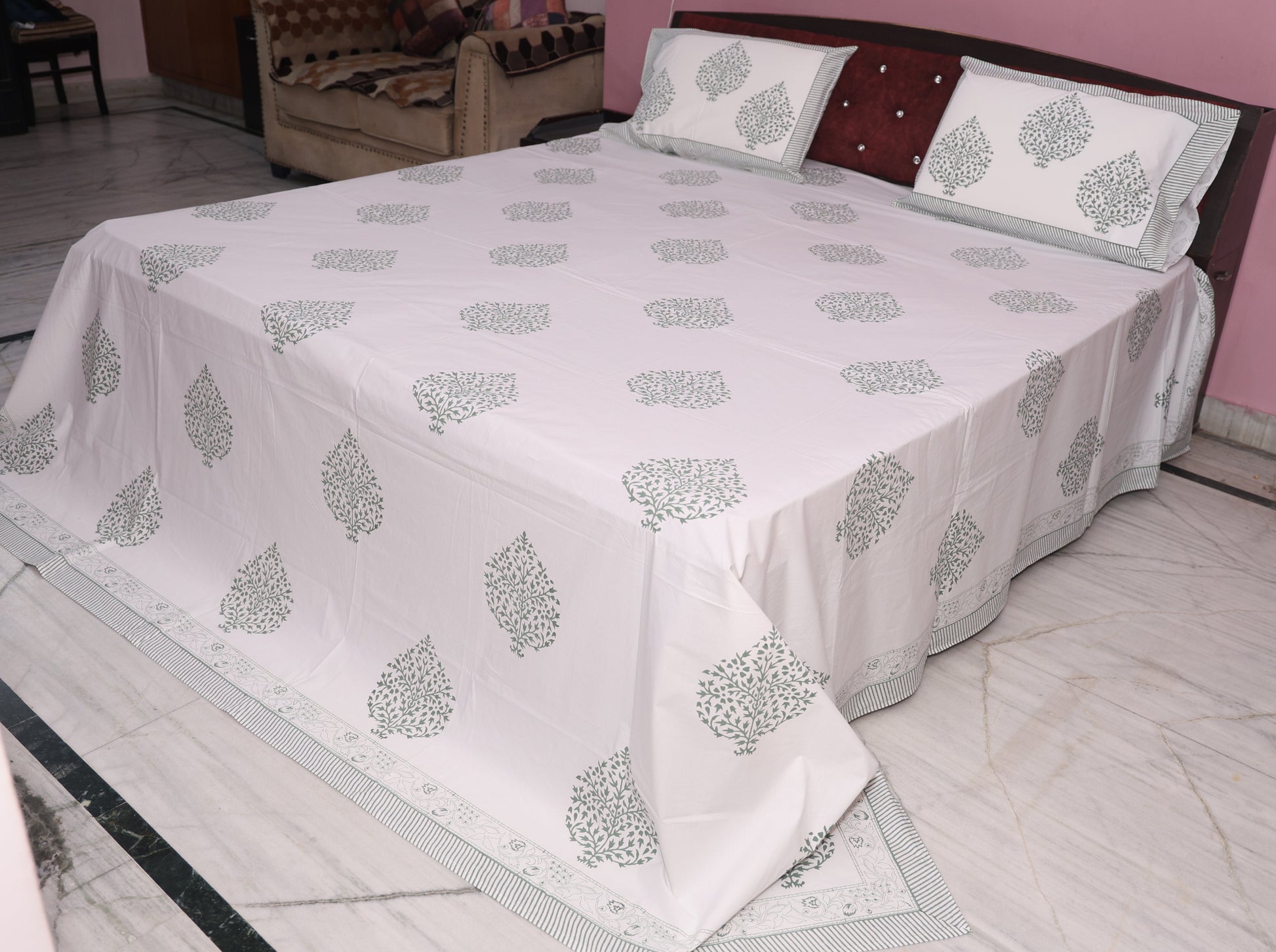 Close-up of slate grey medallion hand block printed pattern on cotton percale fabric