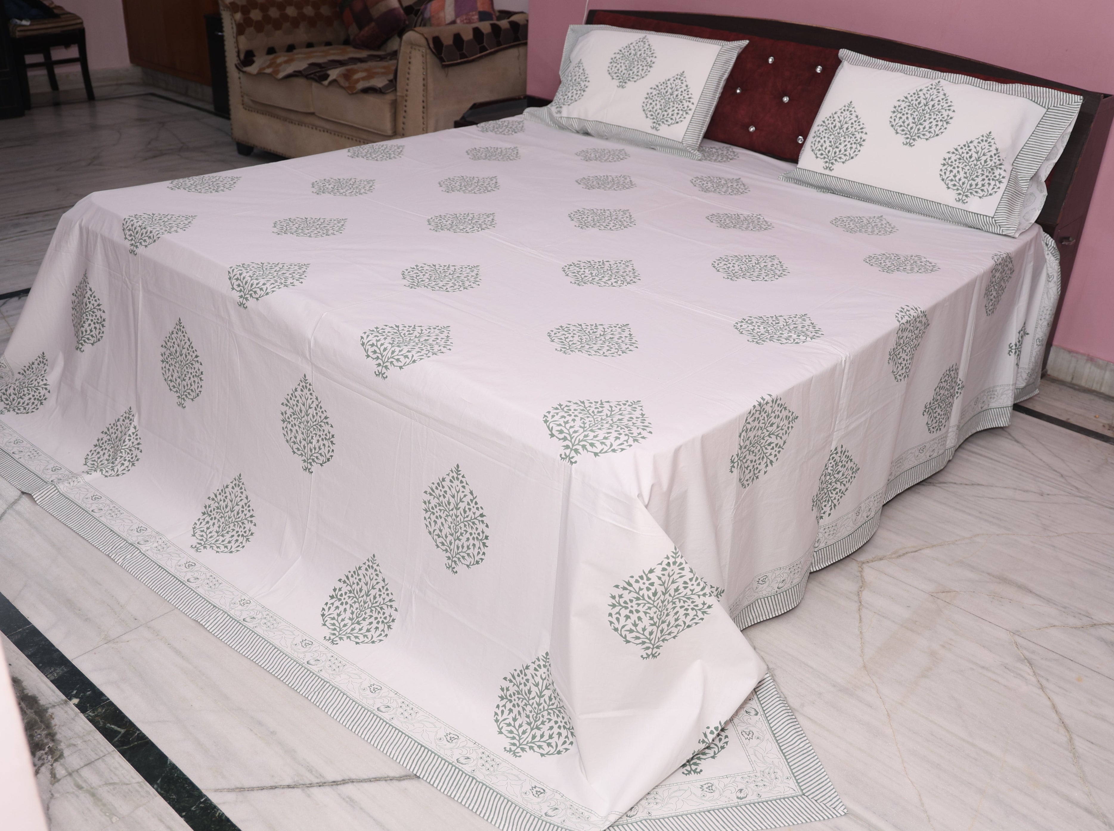 Close-up of slate grey medallion hand block printed pattern on cotton percale fabric