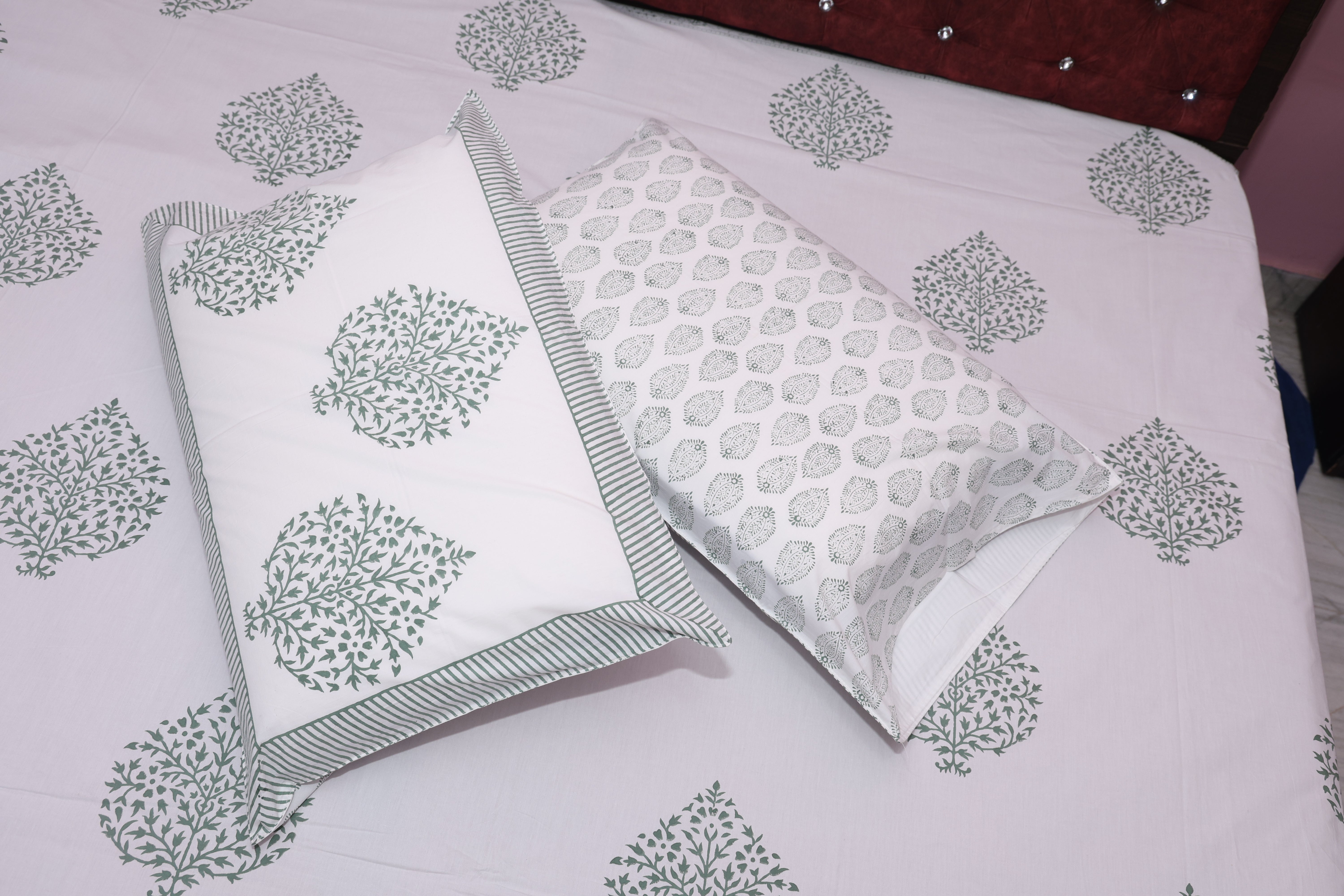 Slate medallion cotton sheet set styled on bed showing grey charcoal medallion print