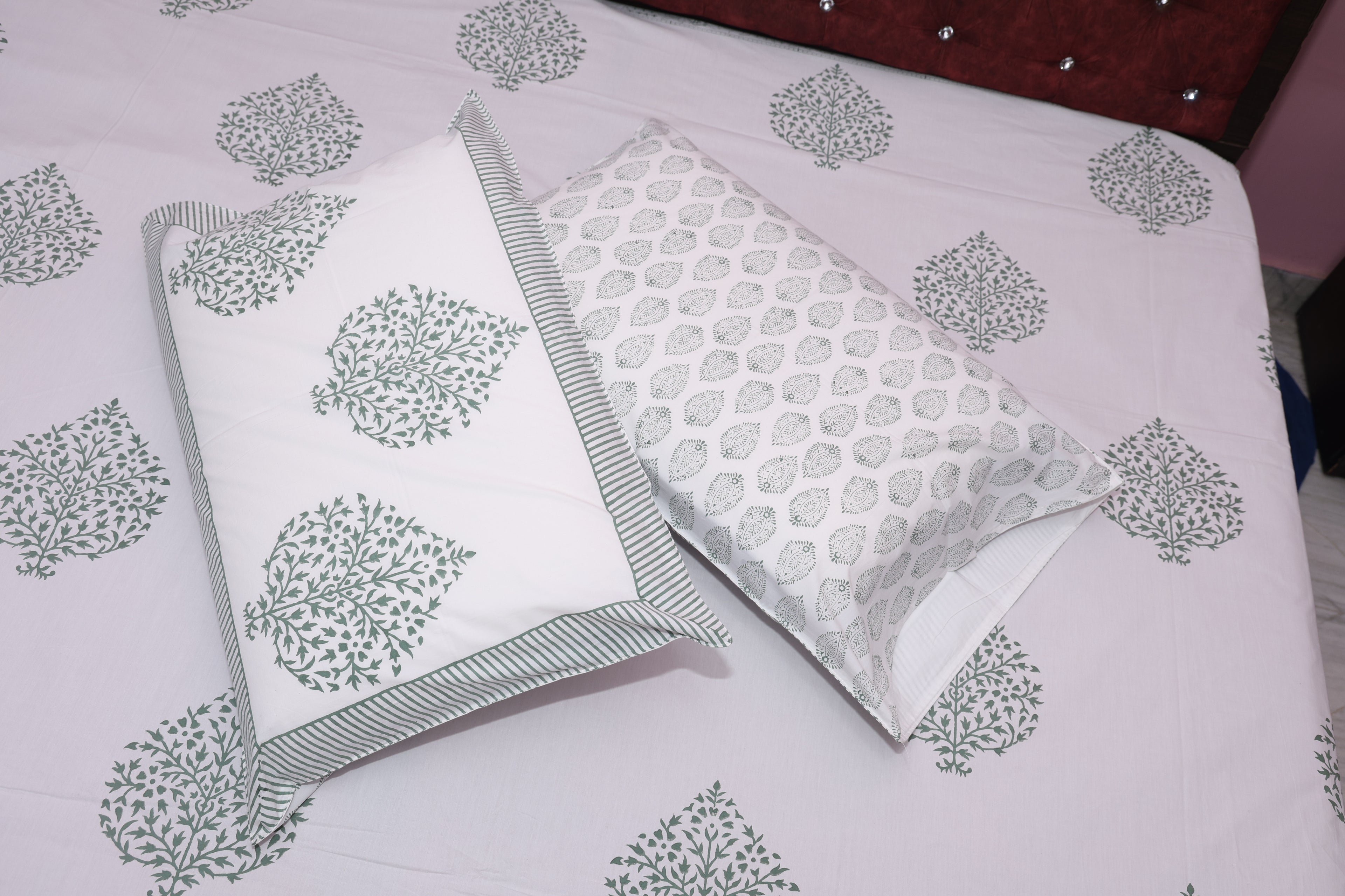 Slate medallion cotton sheet set styled on bed showing grey charcoal medallion print