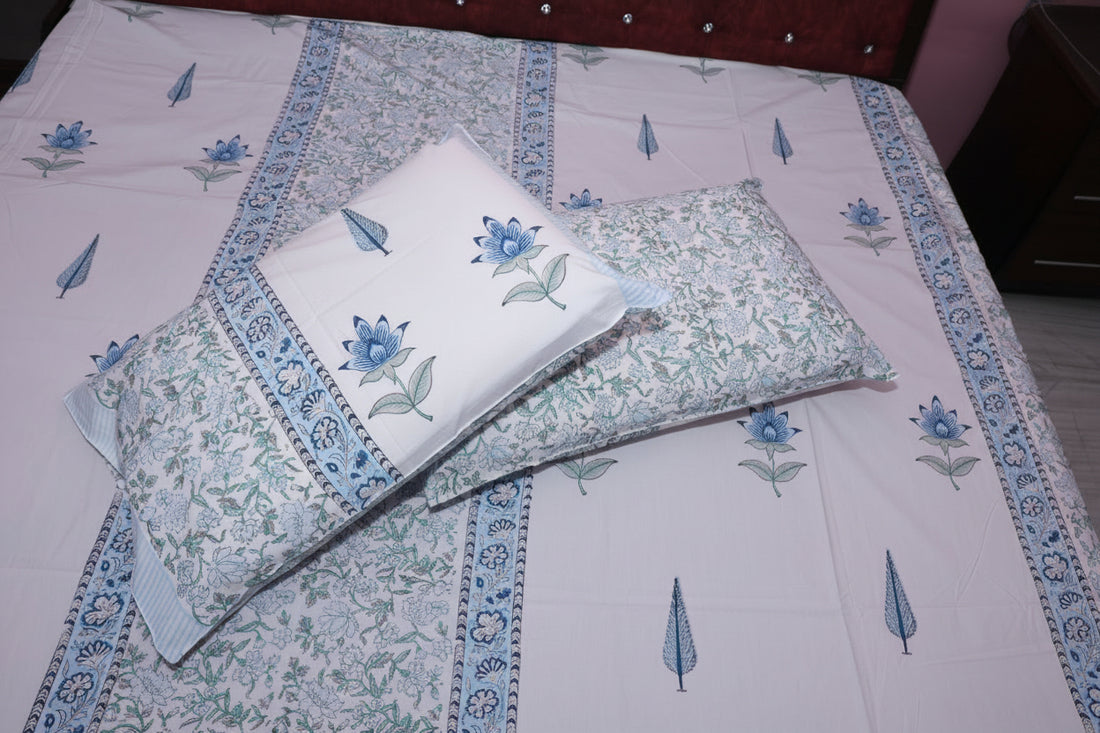Azure Palace hand block printed cotton sheet set with blue lattice pattern on bed — overhead view