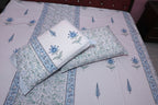 Azure Palace sheet set styled on bed showing drape and blue lattice print pattern