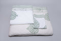 Grey floral bedding set pillow covers and bedsheet detail on styled bed
