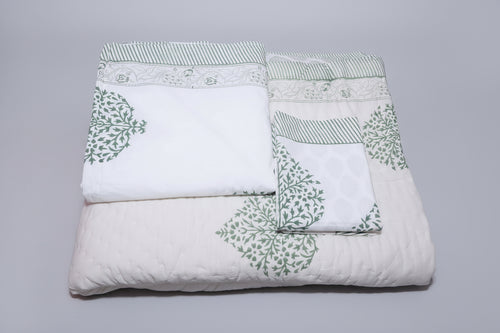 Grey floral bedding set pillow covers and bedsheet detail on styled bed