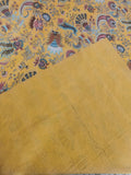 Detail of hand-stitched kantha running stitch on saffron paisley cotton throw