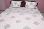 Grey floral hand-block printed cotton bedding set contents — quilt, bedsheet, and pillow covers