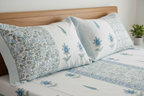 Close-up detail of azure blue hand block printed cotton pillowcase with lattice pattern