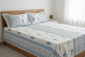 Azure Palace hand block printed cotton sheet set with blue lattice pattern on bed — overhead view