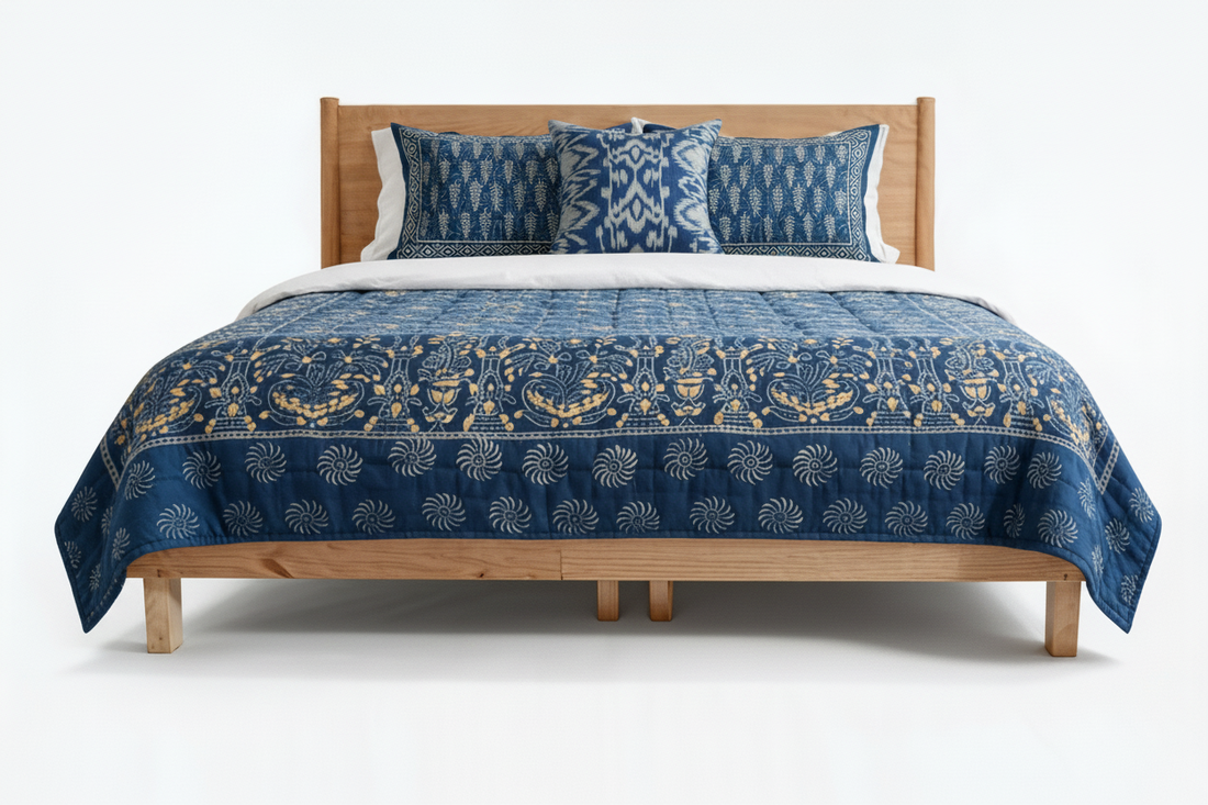 Gilded indigo block print quilt with gold dust accents styled on bed — lifestyle shot