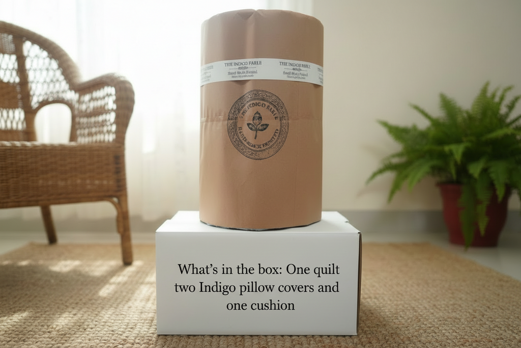 Unopened quilt packaging with product details on a white box in a room setting.