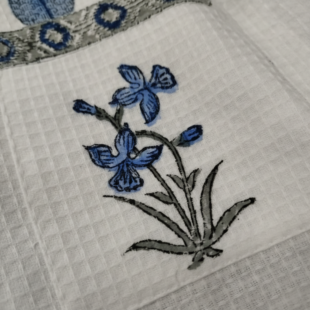 Waffle weave texture close-up on Iris Garden cotton robe